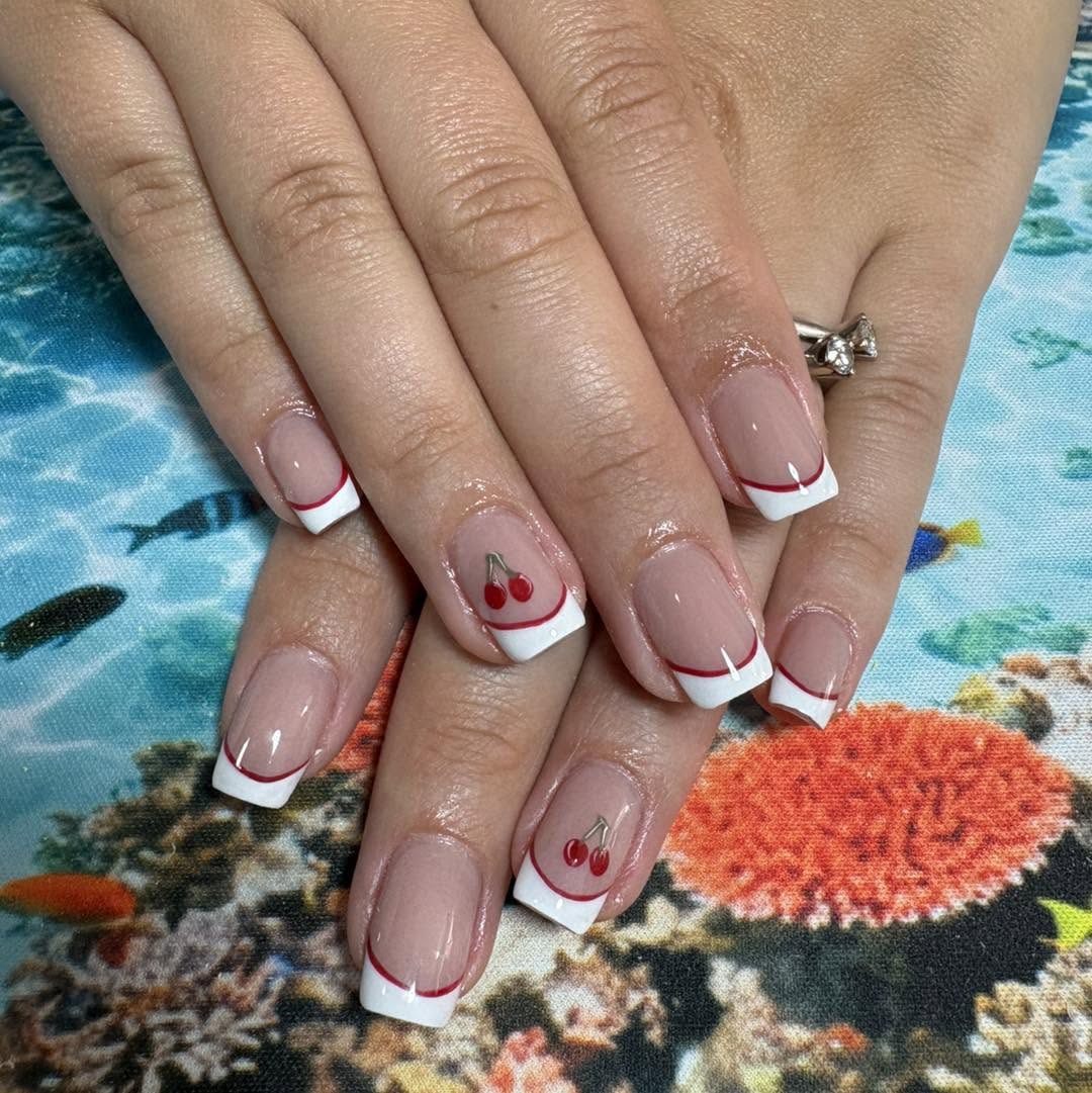Classic red line French manicure with cherry nail art Malta